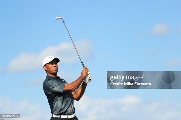 Tiger Woods of the United States plays a shot on the fourth hole during the third round of the Hero World Challenge at Albany, Bahamas on December 2,...