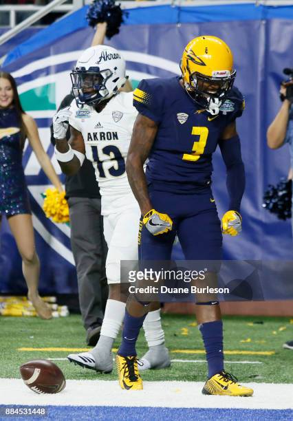 Wide receiver Diontae Johnson of the Toledo Rockets celebrates his touchdown catch against defensive back Denzel Butler of the Akron Zips during the...
