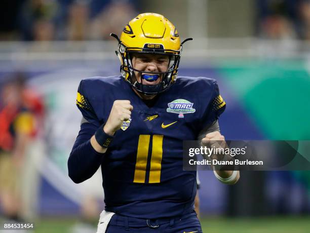 Quarterback Logan Woodside of the Toledo Rockets celebrates a touchdown against Akron during the first half at Ford Field on December 2, 2017 in...