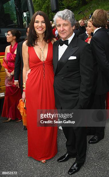 Sports television presenter Marcel Reif and his partner Marion Kiechle depart after attending the church wedding of former tennis star Boris Becker...