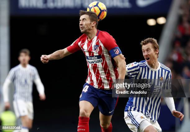 Gabi of Atletico de Madrid in action against David Zurutuza of Real Sociedad during the La Liga match between Club Atletico Madrid and Real Sociedad...