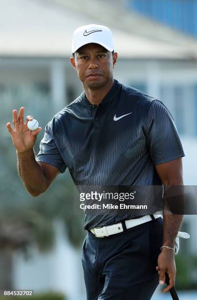 Tiger Woods of the United States reacts to his par on the fifth green during the third round of the Hero World Challenge at Albany, Bahamas on...