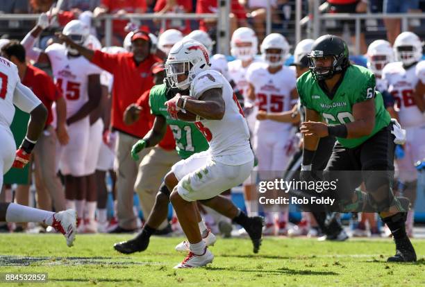 Jalen Young of the Florida Atlantic Owls returns an interception during the Conference USA Championship game against the North Texas Mean Green at...