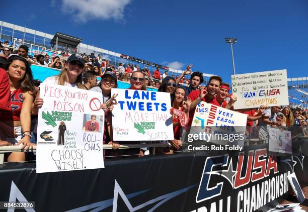 Florida Atlantic Owls fans hold up signs before the Conference USA Championship game against the North Texas Mean Green at FAU Stadium on December 2,...