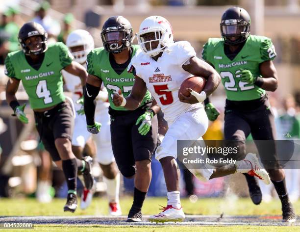 Devin Singletary of the Florida Atlantic Owls carries during the Conference USA Championship game against the North Texas Mean Green at FAU Stadium...