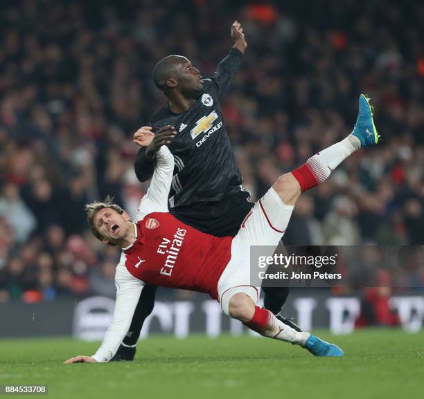 Romelu Lukaku of Manchester United in action with Nacho Monreal of Arsenal during the Premier League match between Arsenal and Manchester United at...