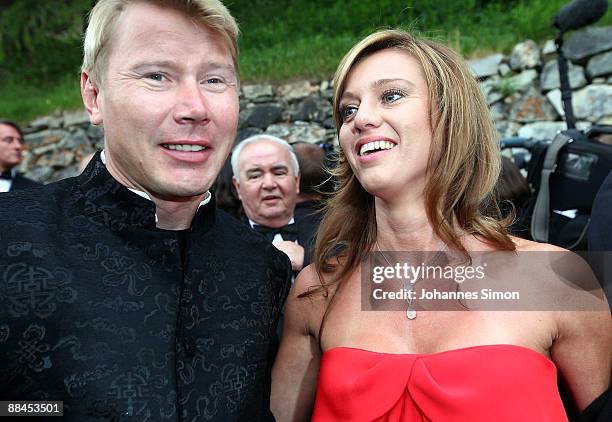 Mika Hakkinen and girlfriend Marketa Kromatova depart after the church wedding of Boris Becker and Sharlely Kerssenberg at the Regina Pacis Chapel on...