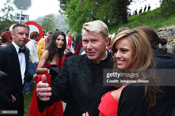 Mika Hakkinen and girlfriend Marketa Kromatova depart after the church wedding of Boris Becker and Sharlely Kerssenberg at the Regina Pacis Chapel on...