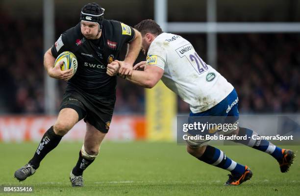 Exeter Chiefs' Thomas Waldrom evades the tackle of Bath Rugby's James Phillips during the Aviva Premiership match between Exeter Chiefs and Bath...