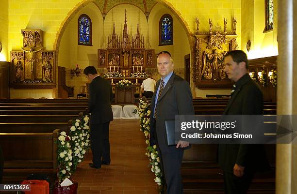 Workers prepare the Regina Pacis Chapel ahead of the church wedding of former tennis star Boris Becker to Sharlely Kerssenberg on June 12, 2009 in St...