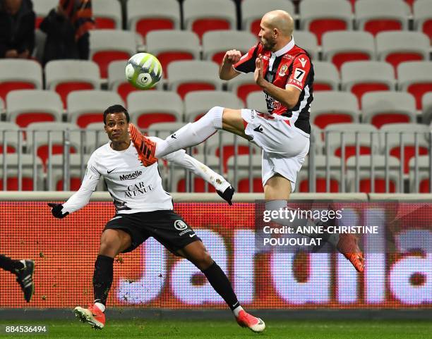 Metz's Senegalese forward Ibrahima Niane vies with Nice's French defender Christophe Jallet during the French L1 football match between Nice and Metz...