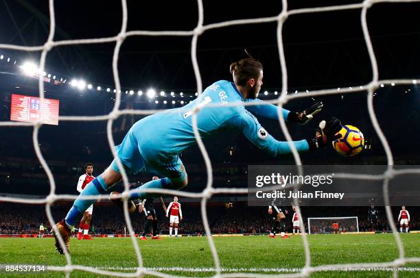 David De Gea of Manchester United makes a save during the Premier League match between Arsenal and Manchester United at Emirates Stadium on December...