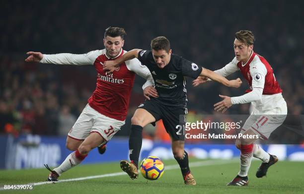 Ander Herrera of Manchester United in action with Sead Kolasinac and Mesut Ozil of Arsenal during the Premier League match between Arsenal and...