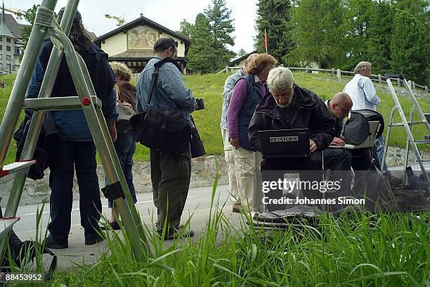 Journalists work in front of the Regina Pacis Chapel during the church wedding of former tennis star Boris Becker to Sharlely Kerssenberg on June 12,...