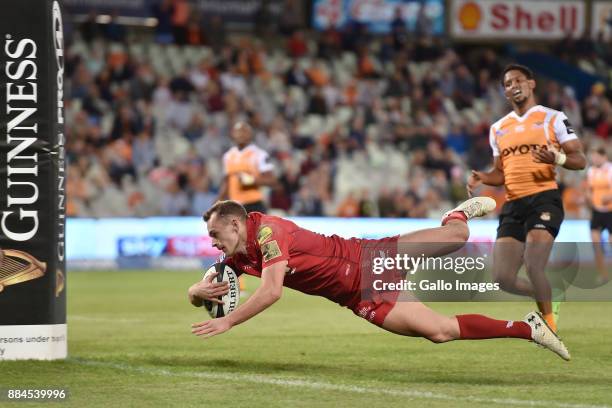 Johnny McNicholl of the Scarlets scoring his try during the Guinness Pro14 match between Toyota Cheetahs and Scarlets at Toyota Stadium on December...