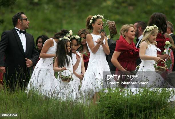 Brides maids and guests depart after attending the church wedding of former tennis star Boris Becker to Sharlely Kerssenberg at the Regina Pacis...