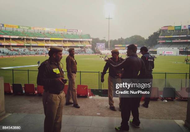 Indian Policemen standing guard during 1st day of 3rd Cricket Test match between India &amp; Srilanka at Feroz Shah Kotla Ground In Delhi , on...