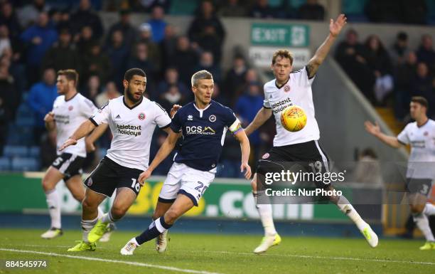 Cameron Carter-Vickers of Sheffield United, Steve Morison of Millwall and Richard Stearman of Sheffield United during Sky Bet Championship match...