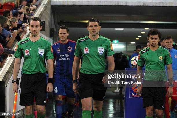 Ryan Gallagher Shaun Evans and Adrian Arndt walk out before the start of play during the round nine A-League match between the Newcastle Jets and...