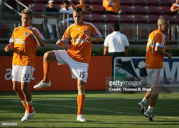 Stuart Holden, Cam Weaver and Wade Barrett of the Houston Dynamo warm up before playing against the Chivas USA at Robertson Stadium on June 10, 2009...