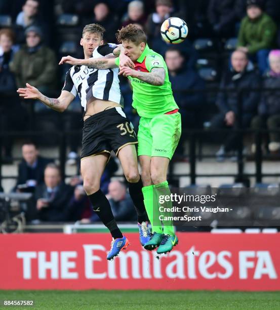 Notts County's Jonathan Stead vies for possession with Oxford City's Joe Oastler during the Emirates FA Cup Second Round match between Notts County...