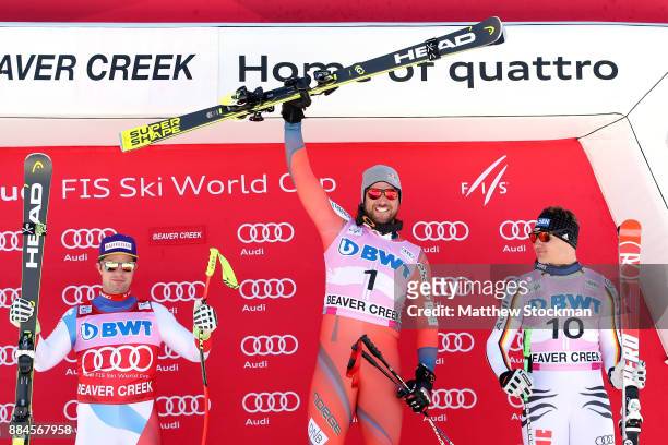 Beat Feuz of Switzerland, Aksel Lund Svindal of Norway and Thomas Dressen of Germany celebrate on the medals podium after the Men's Downhill during...