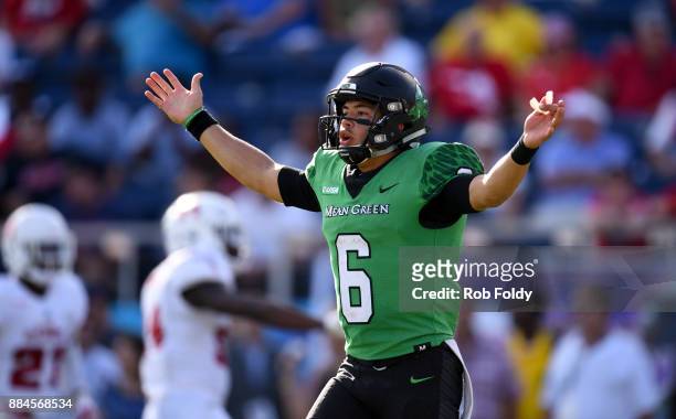 Mason Fine of the North Texas Mean Green gestures during the Conference USA Championship game against the Florida Atlantic Owls at FAU Stadium on...