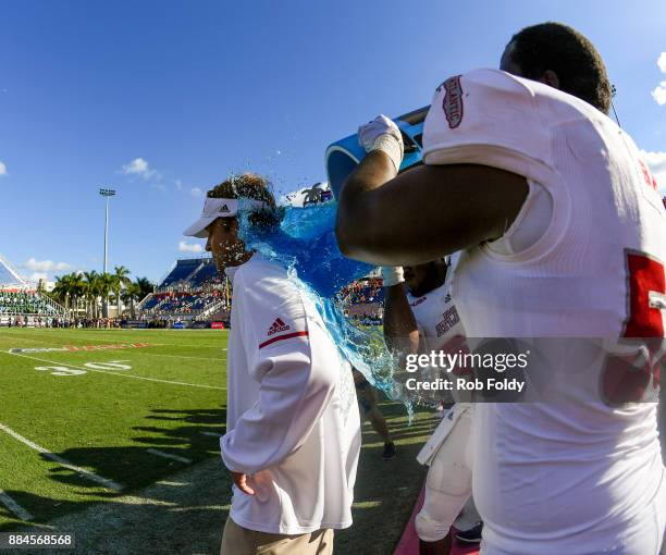 Head coach Lane Kiffin of the Florida Atlantic Owls gets dumped with Powerade during the fourth quarter of the Conference USA Championship game...