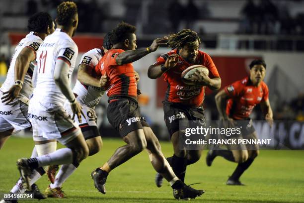 Toulon's French centre Mathieu Bastareaud runs with the ball during the French Top 14 rugby union match between RC Toulon and Lyon on December 2,...