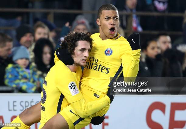 Kylian Mbappe of PSG celebrates his goal with Adrien Rabiot during the French Ligue 1 match between RC Strasbourg Alsace and Paris Saint Germain at...