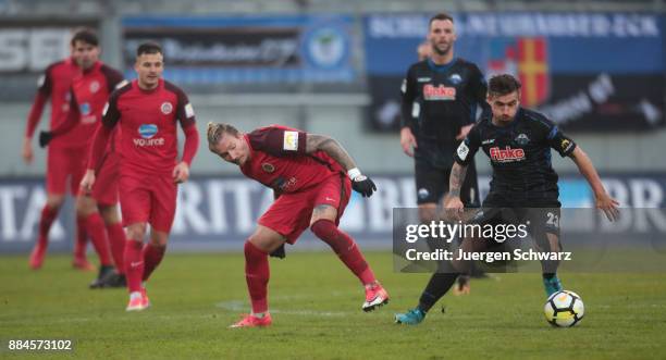 Manuel Schaeffler of Wiesbaden tackles Robin Krausse of Paderborn during the 3. Liga match between SV Wehen Wiesbaden and SC Paderborn 07 at Brita...