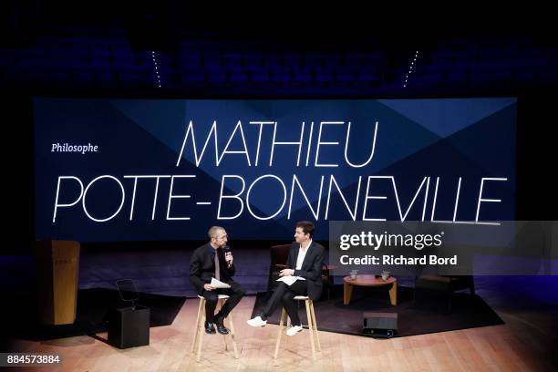 Mathieu Potte Bonneville and Vincent Edin speak on stage during the Introductory Session To The 7th Summit Of Les Napoleons at Maison de la Radio on...