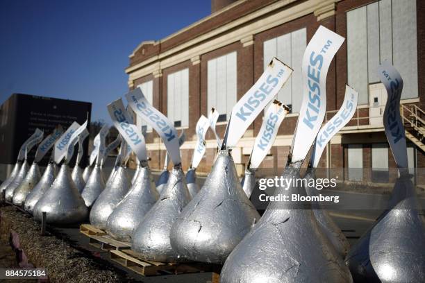 Hershey Co. Kisses candy replica sculptures sit outside of the company's former manufacturing facility in Hershey, Pennsylvania, U.S., on Tuesday,...