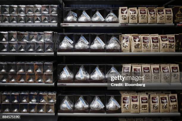 Packages of Hershey Co. Kisses candies are displayed for sale inside of the company's Chocolate World visitor center in Hershey, Pennsylvania, U.S.,...
