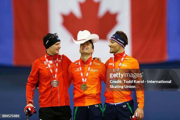 Kai Verbij of the Netherlands celebrates his first place finish with teammate Kjeld Nuis who finished second and Hvard Holmefjord Lorentzen of Norway...