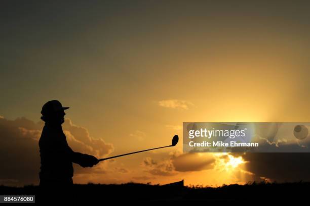 Charley Hoffman of the United States plays his shot from the 18th tee during the third round of the Hero World Challenge at Albany, Bahamas on...