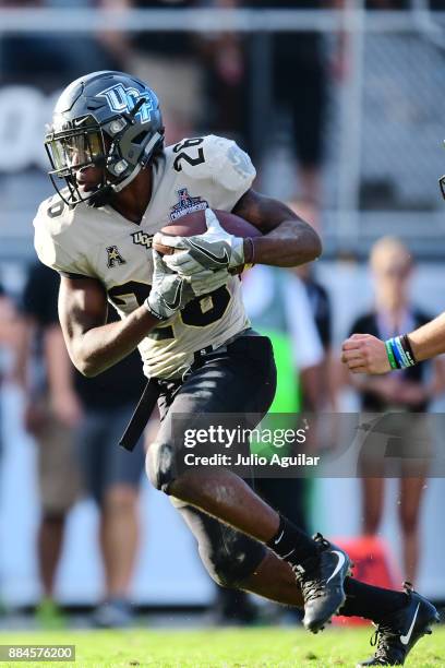 Wide receiver Otis Anderson of the UCF Knights takes the go-ahead touchdown in double overtime to win the ACC Championship over the Memphis Tigers at...