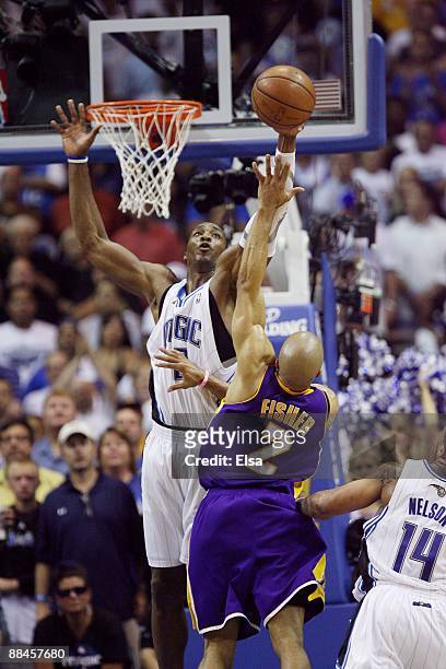 Dwight Howard of the Orlando Magic goes up to block a shot by Derek Fisher of the Los Angeles Lakers in Game Four of the 2009 NBA Finals at Amway...