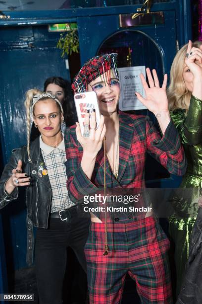 Alice Dellal with host Cara Delevingne attend the Burberry x Cara Delevingne Christmas Party on December 2, 2017 in London, England.