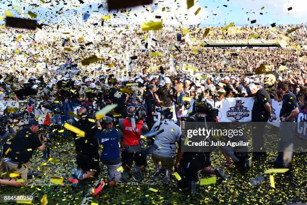 Head coach Scott Frost of the UCF Knights celebrates after winning the ACC Championship 62-55 against the Memphis Tigers at Spectrum Stadium on...