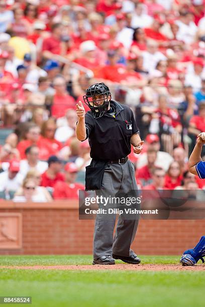 Home plate umpire Chris Guccione calls a strike as the Kansas City Royals play against the St. Louis Cardinals on May 23, 2009 at Busch Stadium in...