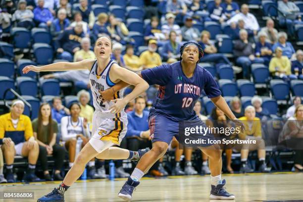 Chattanooga Lady Mocs guard/forward Shelbie Davenport and Tennessee Martin Skyhawks forward Janekia Mason fights for position during the fourth...