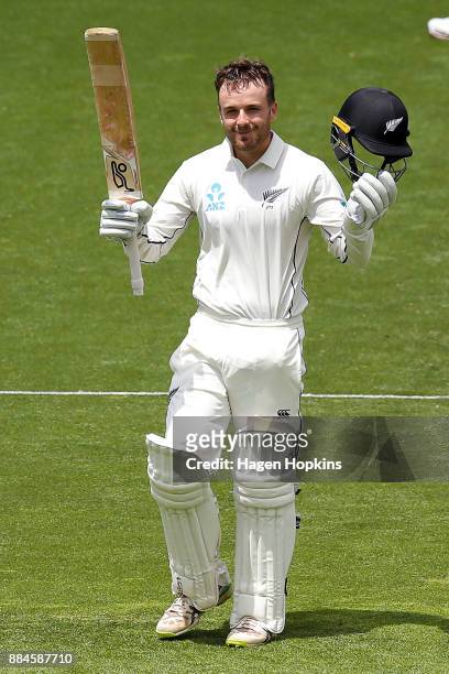 Tom Blundell of New Zealand celebrates after reaching his maiden test century on debut during day three of the Test match series between New Zealand...
