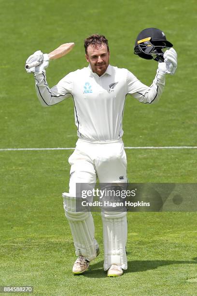 Tom Blundell of New Zealand celebrates after reaching his maiden test century on debut during day three of the Test match series between New Zealand...