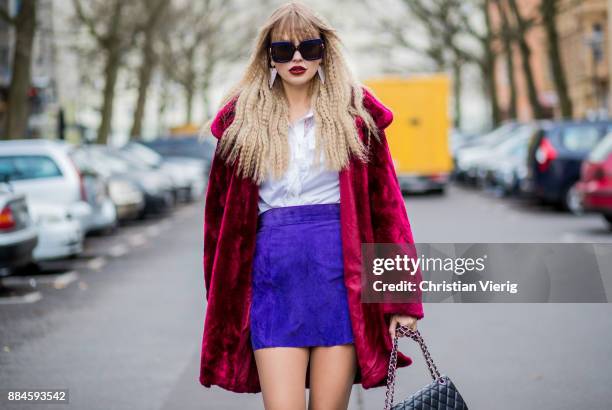 Bonnie Strange wearing a 80s look, red vintage velvet coat, black Escada vintage shoes and white blouse, purple vintage skirt, sunglasses, black...