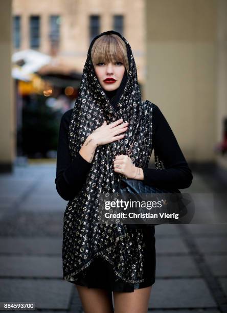 Bonnie Strange wearing a black Louis Vuitton scarf, black Chanel bag, black Weekday skirt, black turtleneck, Escada vintage skirt on December 2, 2017...