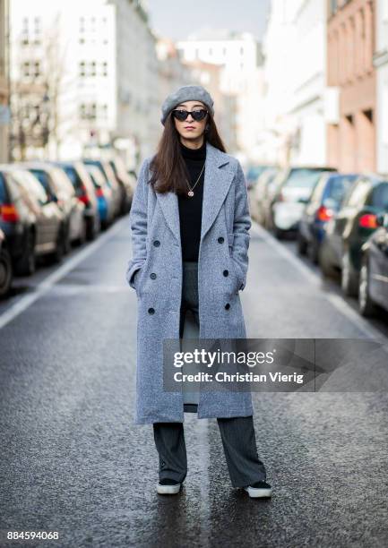 Nadia Ali wearing grey beret Zara, Mango sunglasses, a grey coat Mint & Berry, black turtleneck Repeat Cashmere, grey pants Zara, black Vans...