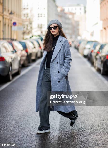 Nadia Ali wearing grey beret Zara, Mango sunglasses, a grey coat Mint & Berry, black turtleneck Repeat Cashmere, grey pants Zara, black Vans...