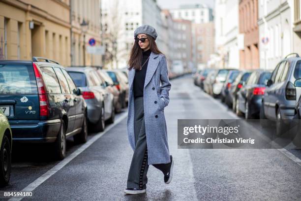 Nadia Ali wearing grey beret Zara, Mango sunglasses, a grey coat Mint & Berry, black turtleneck Repeat Cashmere, grey pants Zara, black Vans...