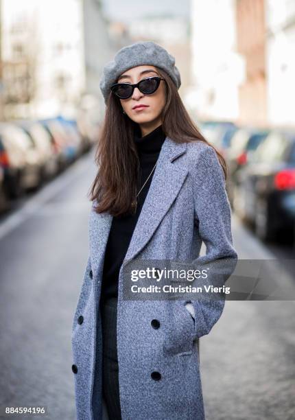Nadia Ali wearing grey beret Zara, Mango sunglasses, a grey coat Mint & Berry, black turtleneck Repeat Cashmere, grey pants Zara, black Vans...
